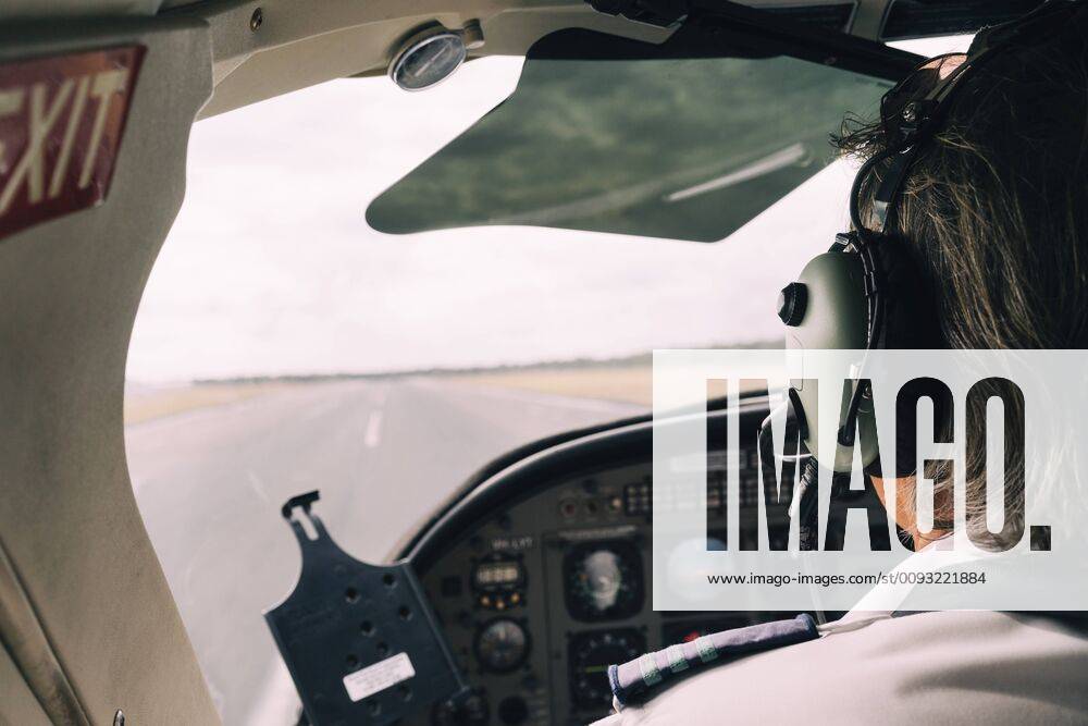 Pilot and dashboard of a small plane on the runway ready to take off GEMF02995