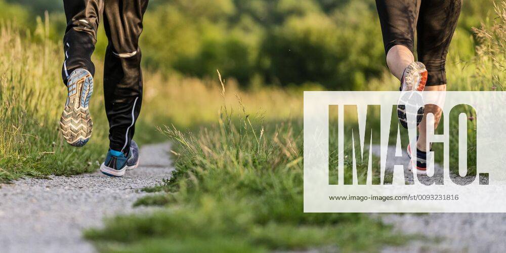 Creative Highlights Symbolfoto Legs of man and woman jogging model released Symbolfoto STSF02057