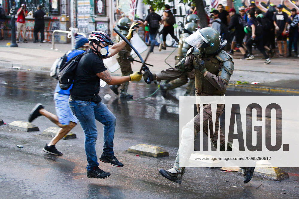 For more than a month to continue the protests in Plaza Italia against the government of President Sebastian Pinera In the photograph a demonstrator confronts special forces carabineros Ramon Monroy Aton Chile, Santiago Chile Aton 375280