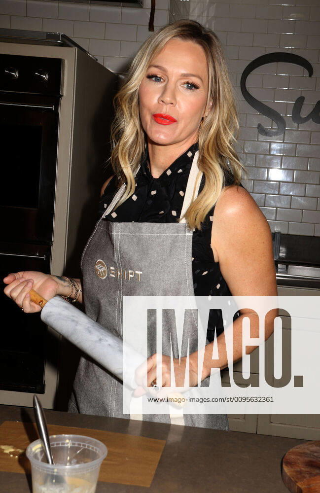 Actress JENNIE GARTH from Beverly Hills 90210 holds a rolling pin at the partnership launch of Shipt, a grocery delivery service and kitchenware retailer Sur La Table. New York USA - ZUMAk03_ 20191210_zaf_k03_099
