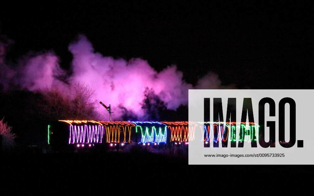 The Nene Valley Railway Winter Light Spectacular steam train locomotive travels through the darkness as it makes is way towards Peterborough, Cambridgeshire, UK, on December 14, 2019