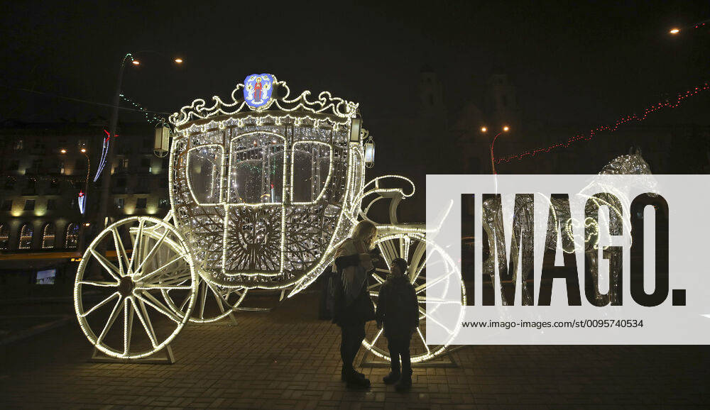 MINSK, BELARUS – DECEMBER 15, 2019: A carriage made of festive lights in a street ahead of the holiday season. Natalia Fedosenko TASS TS0C774D