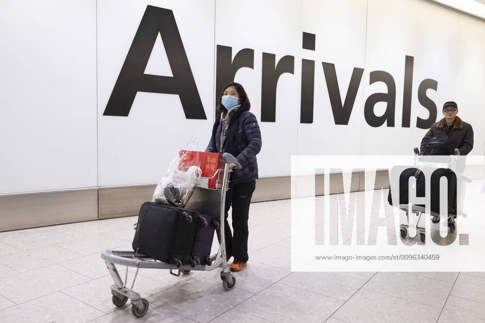 London, UK. Passengers wearing face masks arrive at Heathrow airport after China Southern Airlines flight CZ673 from Wuhan arrives in London. The Coronavirus virus has originated in the Wuhan region. London UK - ZUMAl94_ 20200122_zaf_l94_047