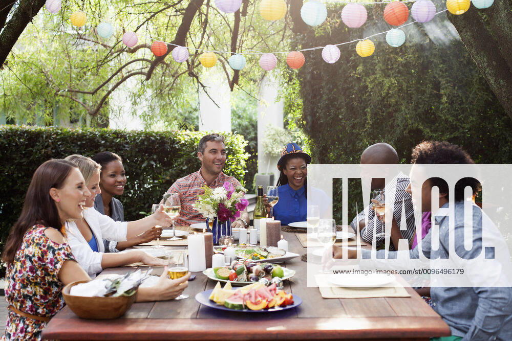 Friends gathered around party table