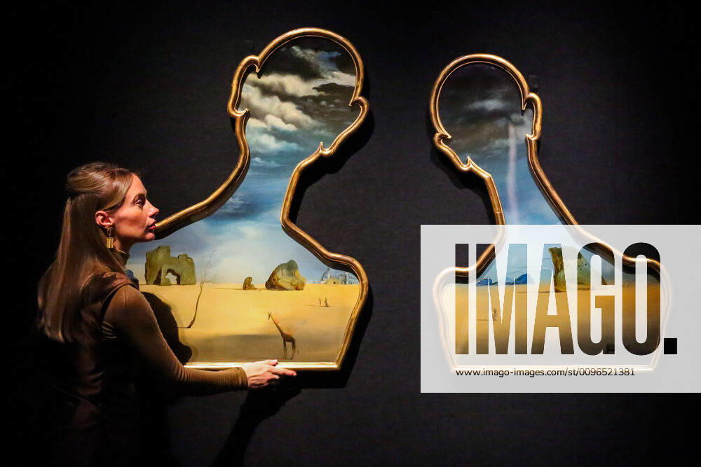 London, UK. A staff member holds Salvador Dali, Couple aux têtes de pleins nuages (1937) (est £7m to £10m) at the preview of Bonhams Impressionist and Modern Art Sale. London UK - ZUMAl94_ 20200129_zaf_l94_048