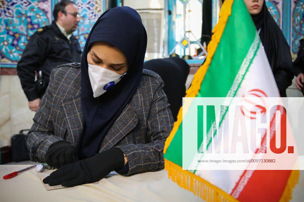 Iranians vote during parliamentary election at a polling station in Tehran, Iran. Iranians began voting in a parliamentary election which conservatives are expected to dominate, capitalizing on public anger against moderate conservative President Hassan Rouhani over a ravaged economy, corruption, and multiple crises. Tehran Iran - ZUMAf146 20200221_zip_f146_054