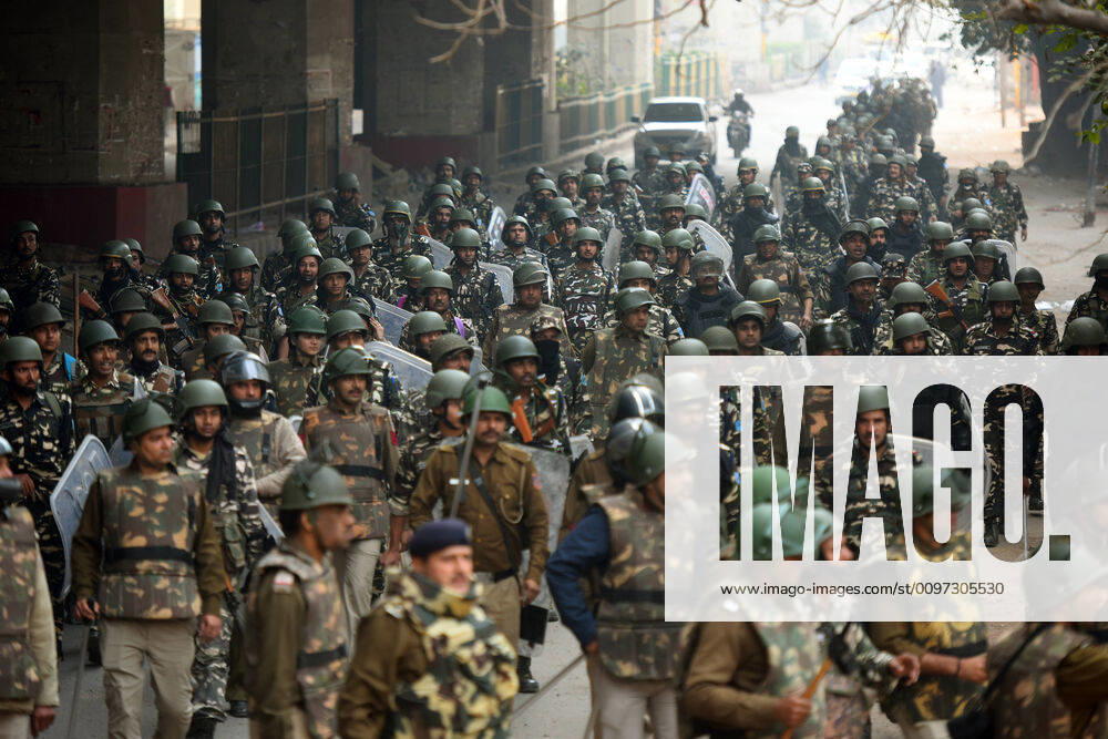 KW09 NEW DELHI, INDIA - FEBRUARY 26: Paramilitary soilders conduct a flag march following clashes over the new citizenship law, at Maujpur, on February 26, 2020 in New Delhi, India. Adequate security has been deployed in Maujpur, Seelampur, Gokulpuri and other localities of Northeast Delhi which have seen violent protests in the last three days. Stones were pelted at the police, houses burnt and vehicles smashed. Seventeen people, including a Delhi Police head constable, have been killed in the clashes, and more than 250 injured. (Photo by Amal KS Hindustan Times) Delhi Violence Aftermath In Maujpur, Jafrabad, Chand Bagh, Karawal Nagar