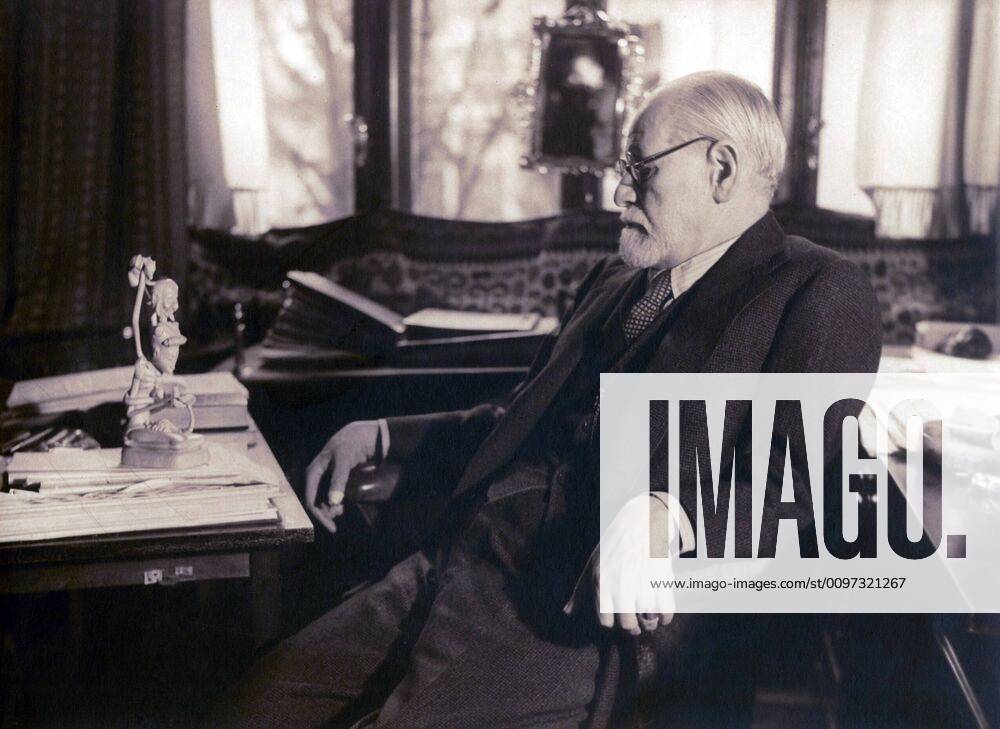 Sigmund Freud seated in his study contemplating a carved figurine (possibly Javanese) on his desk in 1937 photography by Princess Marie Bonaparte. Courtesy Everett Collection PUBLICATIONXNOTxINxCANxCHNxFRAxITAxJPNxNORxPOLxRUSxESPxUKxUSA