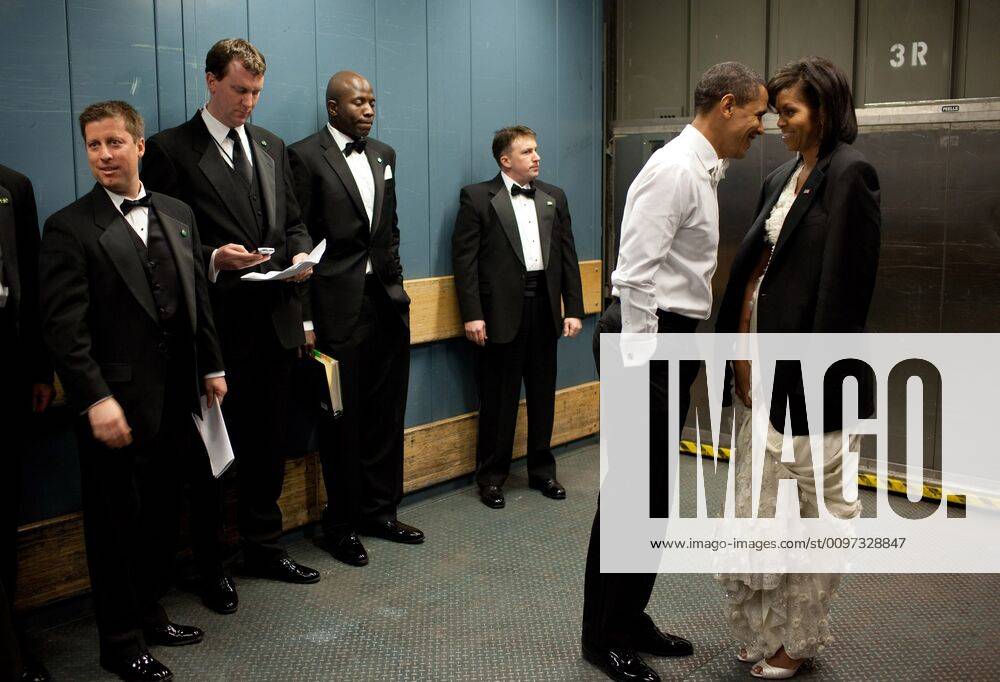 President and Michelle Obama share a semi-private moment on a freight elevator between Inaugural Balls amidst staff and Secret Service agents. Michelle wears the President s jacket to ward of the chill. (BSWH_2011_8_50) Courtesy Everett Collection PUBLICATIONXNOTxINxCANxCHNxFRAxITAxJPNxNORxPOLxRUSxESPxUKxUSA