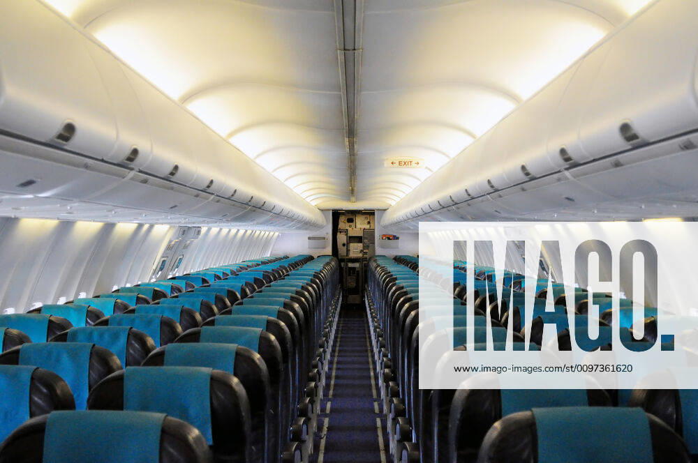 Interior of a passenger airliner Empty passengers cabin in commercial jet airplane
