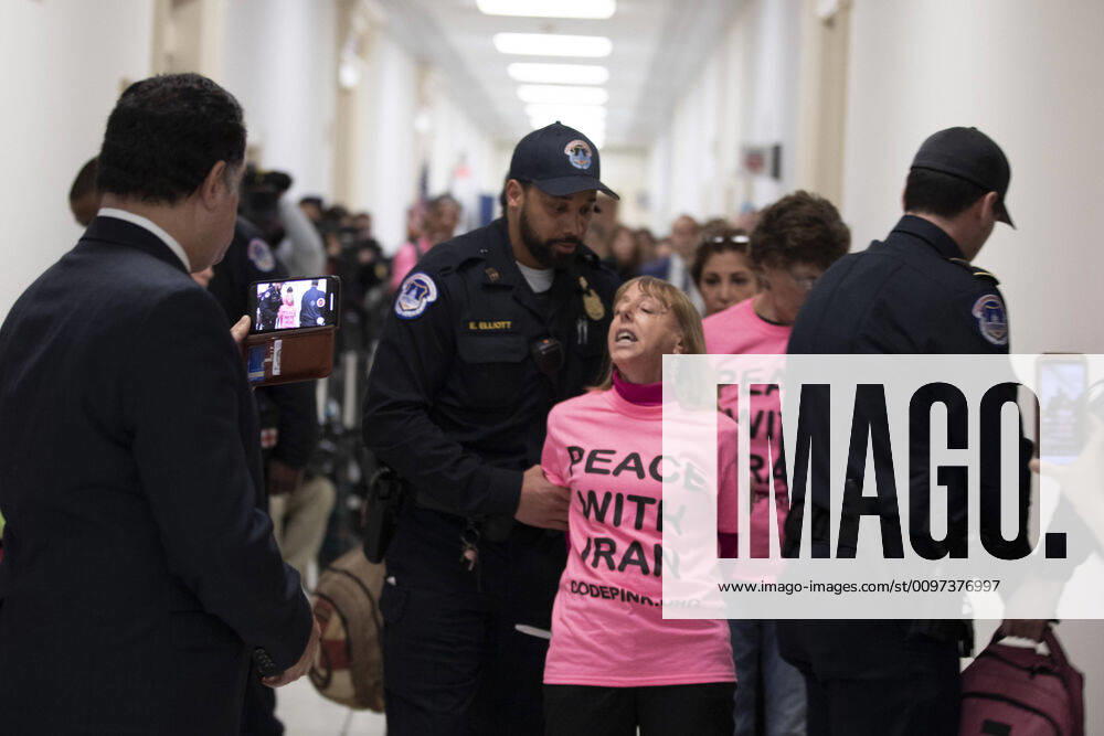 Protesters are escorted out as Secretary of State Mike Pompeo testifies at the House Foreign Affairs Committee on Capitol Hill in Washington, D.C. on Friday, February 28, 2020. WAP20200128019 TASOSxKATOPODIS