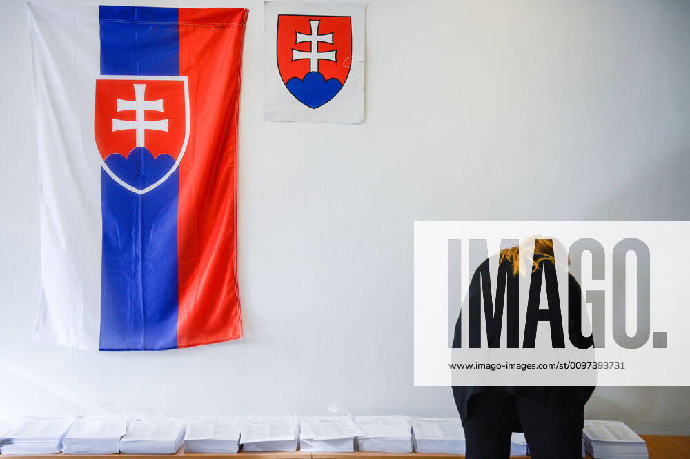 An election official organises ballots at a polling station during the Parliamentary elections in Trnava. Trnava Slovakia - ZUMAs197 20200229_zaa_s197_031