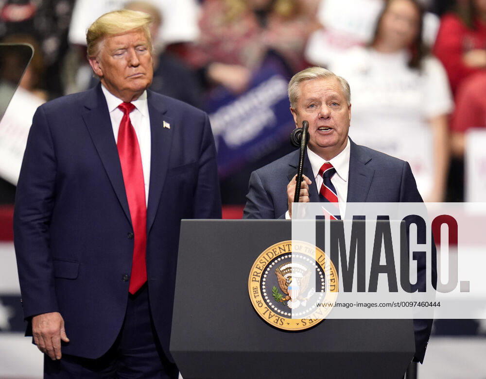 United States Senator LINDSEY GRAHAM addresses the crowd as President DONALD TRUMP looks on during a Keep America Great rally at the Bojangles Coliseum in Charlotte, North Carolina on Monday March 2, 2020. 14 states and American Samoa will vote or caucus on Tuesday March 3rd. Their ballots will represent over 33 percent of the national primary totals. Charlotte USA - ZUMAj110 20200302_zsp_j110_037