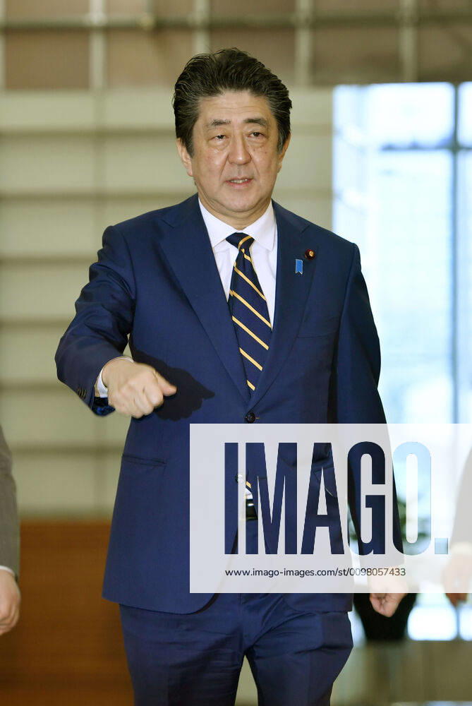 Japan PM Abe Japanese Prime Minister Shinzo Abe arrives at his office in Tokyo on March 17, 2020.