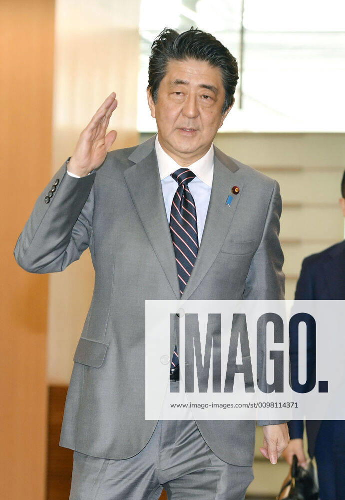 Japan PM Abe Japanese Prime Minister Shinzo Abe arrives at his office in Tokyo on March 18, 2020.