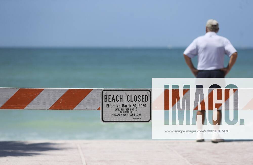 A look at the mostly empty beach with the beach closed sign and burricade near the steps leading down to the sand on Saturday, March 21, 2020 at Pass-a-Grille. Pinellas County beaches are now closed. Pinellas County announced that all public beaches closed starting onSaturday. Pass-A-Grille USA - ZUMAs70_ 20200321_zan_s70_009