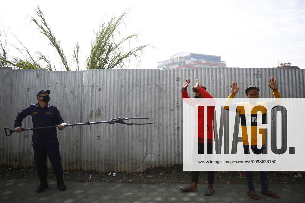 A policeman arresting lockdown violators using a multifunctional device that lets him maintain social distance on the fifth day of government imposed nationwide lockdown amid concerns over the coronavirus pandemic in Kathmandu, Nepal on Saturday, March 28, 2020. Kathmandu Nepal - ZUMAg200 20200328_zap_g200_003
