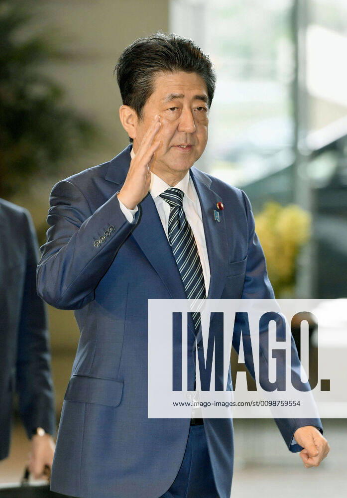 Japan PM Abe Japanese Prime Minister Shinzo Abe arrives at his office in Tokyo on March 31, 2020.