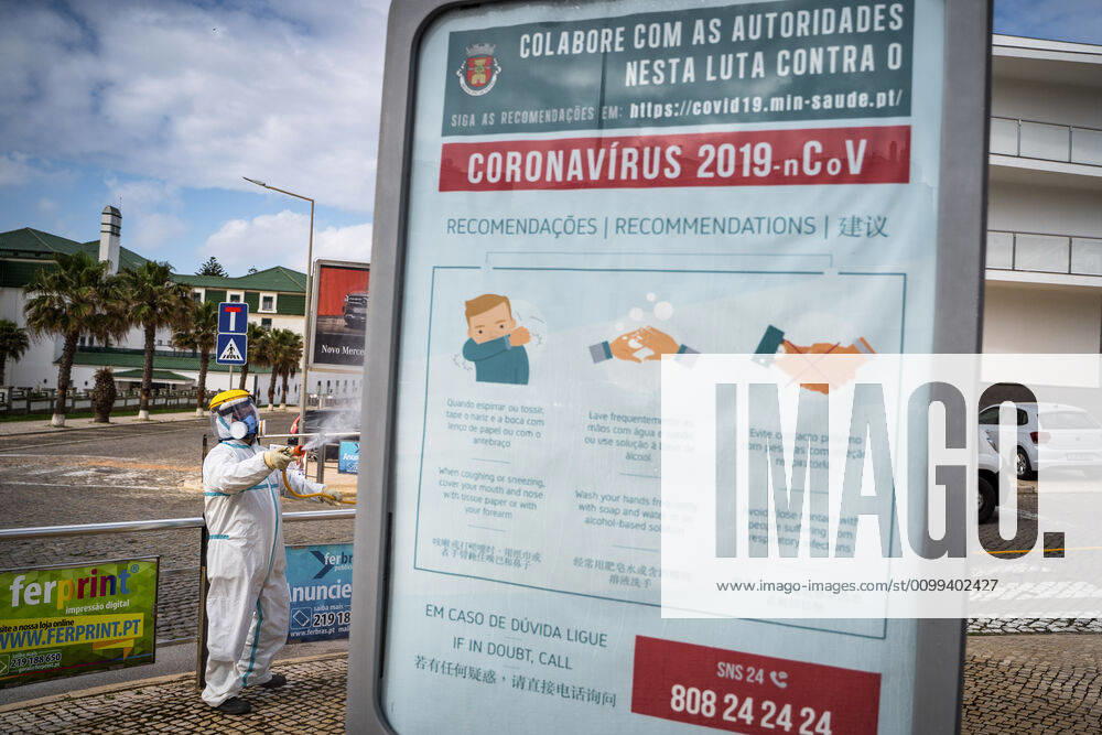 An employee of the Ericeira parish council, equipped with the recommended protective materials, disinfects the street with a solution based on hypochlorite (bleach)..The municipality of Mafra had 70 cases of COVID-19 pandemic. In order to prevent the spread of the virus, the Ericeira Parish Council perform weekly street disinfection. Ericeira Portugal - ZUMAs197 20200414_zaa_s197_175