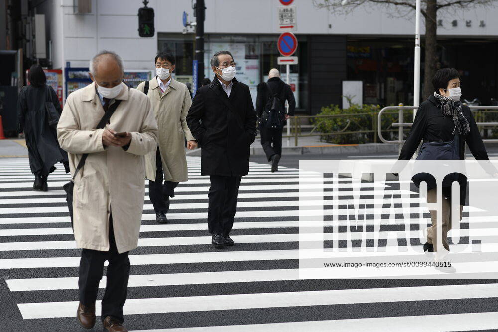 Commuters wearing face mask head to work early morning in Shinjuku, Tokyo on Friday, April 17, 2020. The Japanese government decided to expand the current areas under a state of emergency to nationwide, as the Covid-19 coronavirus outbreak continues to spread throughout the country. (Photo: Richard Atrero de Guzman AFLO) (125423269)