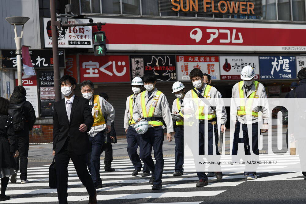 Commuters wearing face mask head to work early morning in Shinjuku, Tokyo on Friday, April 17, 2020. The Japanese government decided to expand the current areas under a state of emergency to nationwide, as the Covid-19 coronavirus outbreak continues to spread throughout the country. (Photo: Richard Atrero de Guzman AFLO) (125423298)