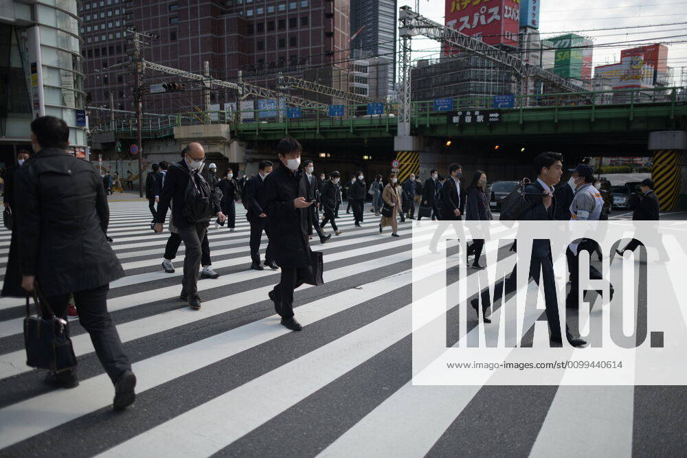 Commuters wearing face mask head to work early morning in Shinjuku, Tokyo on Friday, April 17, 2020. The Japanese government decided to expand the current areas under a state of emergency to nationwide, as the Covid-19 coronavirus outbreak continues to spread throughout the country. (Photo: Richard Atrero de Guzman AFLO) (125423642)