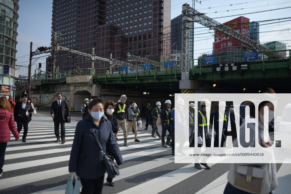 Commuters wearing face mask head to work early morning in Shinjuku, Tokyo on Friday, April 17, 2020. The Japanese government decided to expand the current areas under a state of emergency to nationwide, as the Covid-19 coronavirus outbreak continues to spread throughout the country. (Photo: Richard Atrero de Guzman AFLO) (125423692)