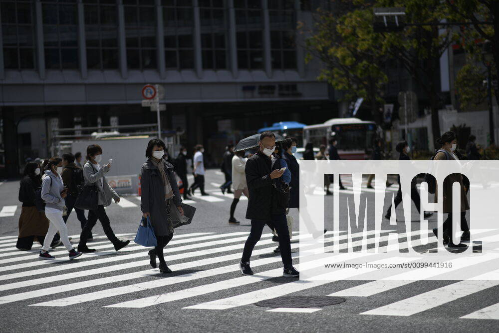 Commuters wearing face mask walks in near JR Shibuya Station in Tokyo on Friday, April 17, 2020. The Japanese government decided to expand the current areas under a state of emergency to nationwide, as the Covid-19 coronavirus outbreak continues to spread throughout the country. (Photo: Richard Atrero de Guzman AFLO) (125429982)