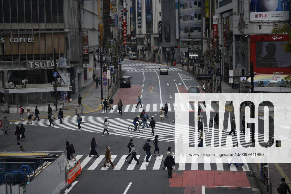 Commuters wearing face mask were seen crossing the street near JR Shibuya Station in Tokyo on Friday, April 17, 2020. The Japanese government decided to expand the current areas under a state of emergency to nationwide, as the Covid-19 coronavirus outbreak continues to spread throughout the country. (Photo: Richard Atrero de Guzman AFLO) (125429999)