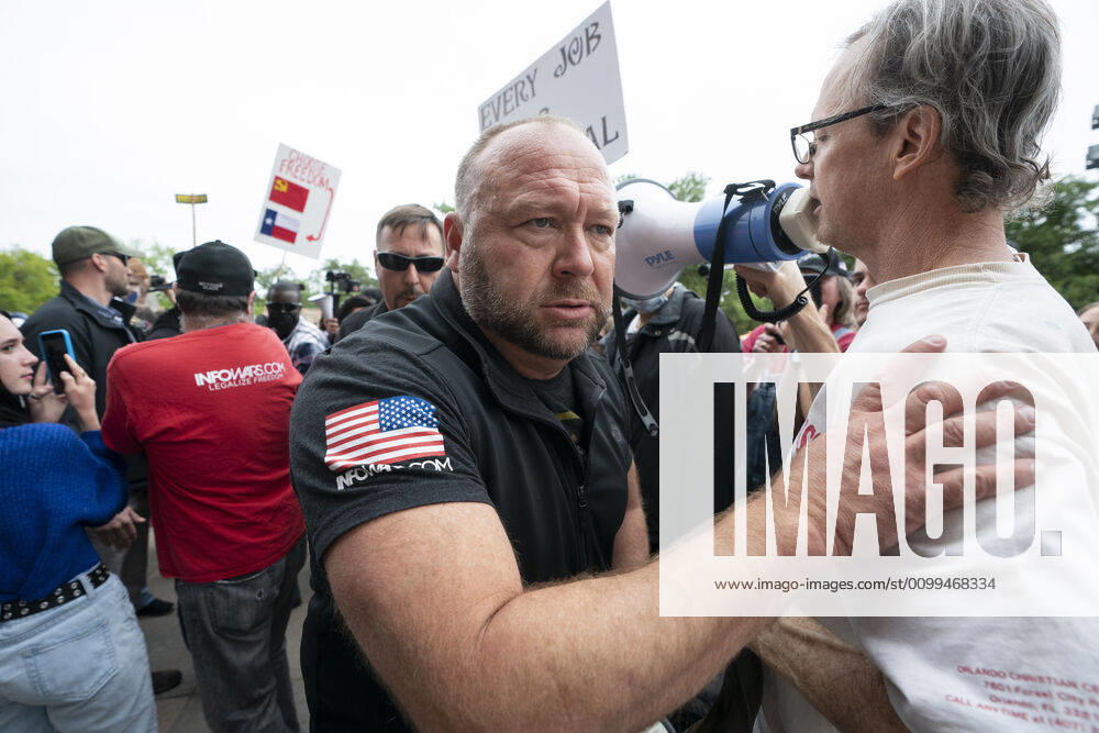 Alex Jones works his way through the crowd as a few hundred Texans flaunt social distancing guidlines in an InfoWars inspired rally at the Texas Capitol where founder Jones encourages the crowd with right-wing rhetoric. Gov. Greg Abbott announced Friday relaxed restrictions on business starting next week. Austin USA - ZUMAd150 20200418_znp_d150_001