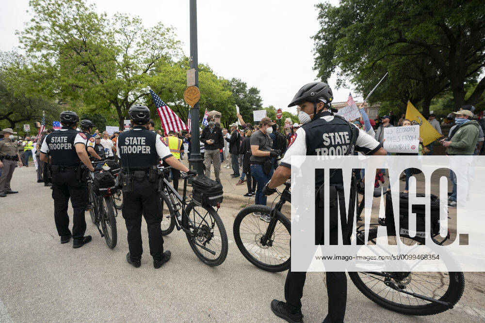 Dept. of Public Safety troopers arrive as a few hundred Texans flaunt social distancing guidelines in an InfoWars inspired rally at the Texas Capitol where founder Alex Jones encourages the crowd with right-wing rhetoric. Gov. Greg Abbott announced Friday relaxed restrictions on business starting next week. Austin USA - ZUMAd150 20200418_znp_d150_021