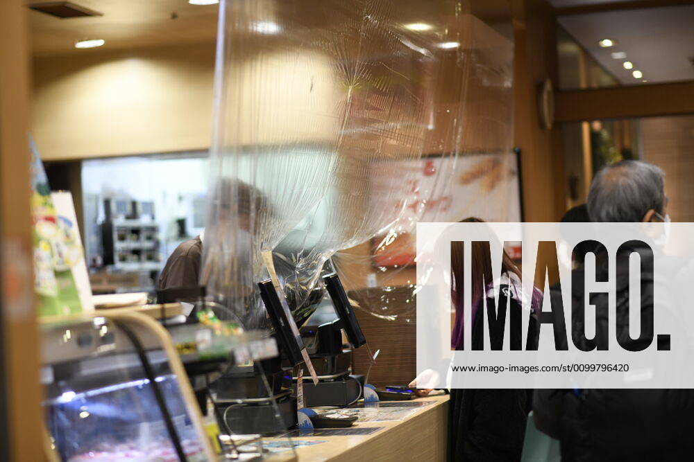 A plastic sheet curtain is placed between a cashier and a shopper is seen near Shinjuku Station amid the coronavirus pandemic on Thursday, April 23, 2020 in Tokyo, Japan. Japanese Prime Minister Shinzo Abe declared a nationwide State of Emergency last week requesting businesses including schools, athletic facilities, bars and restaurants to temporarily close or operate under reduced hours and urging people to stay home to stop spreading of the coronavirus throughout the country. (Photo: Richard Atrero de Guzman AFLO) (125658874)