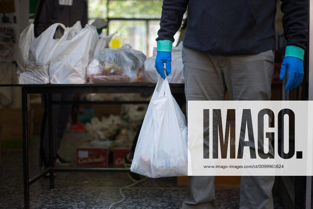 Spain: Food distribution due to Covid-19 crisis A volunteer delivers food at the Aluche Neighbors Association Madrid Madrid Spain