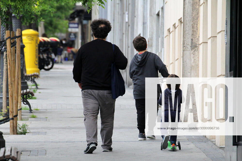 A family walks the streets of Madrid during the first day of permission so that the children can spend an hour daily on the street during the health crisis due to the Covid-19 virus pandemic - Coronaviruss. April 26,2020. (2020042601)