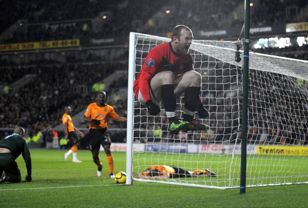 Wayne Rooney of Manchester United celebrates the second goal turned in by Andy Dawson of Hull City from a Rooney cross --- Premier League: Hull City (orange) vs. Manchester United (red), 27th December, 2009 EDITORIAL USE ONLY. No use with unauthorised audio, video, data, fixture lists, club league logos or live services. Online in-match use limited to 120 images, no video emulation. No use in betting, games or single club league player publications. o0 Jubel Freude