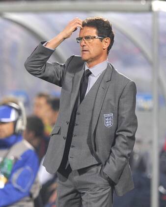 Fabio Capello coach of England ponders his next move, FIFA World Cup 2010 Group C, England - USA 12th June, 2010 - EDITORIAL USE ONLY. No use with unauthorised audio, video, data, fixture lists, club league logos or live services. Online in-match use limited to 120 images, no video emulation. No use in betting, games or single club league player publications. o0 Nationaltrainer, Trainer