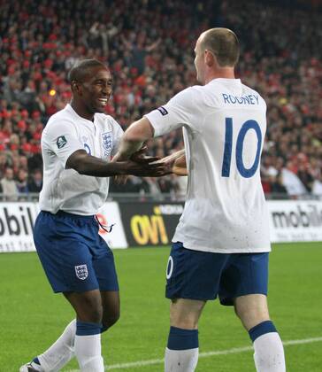 England s Wayne Rooney celebrates scoring his sides opening goal with Jermain Defoe European Championship Qualifying Group G Switzerland v England 7th September, 2010 EDITORIAL USE ONLY. No use with unauthorised audio, video, data, fixture lists, club league logos or live services. Online in-match use limited to 120 images, no video emulation. No use in betting, games or single club league player publications.
