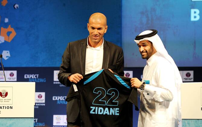 DOHA, Sept. 16, 2010 - Zinedine Zidane (FRA, L) receives a personalized jersey from CEO of the Qatar 2022 Bid Committee Hassan Al Thawadi in Doha, capital of Qatar, Sept. 16, 2010. Zinedine Zidane on Thursday accepted Qatar s invitation to become the official ambassador of the country s bidding for the 2022 FIFA World Cup finals. 