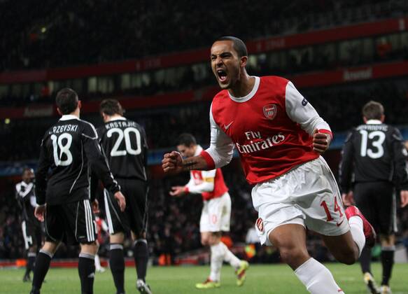 Arsenals Theo Walcott celebrates scoring his sides second goal - Champions League - Arsenal FC London - Partizan Belgrad - EDITORIAL USE ONLY. No use with unauthorised audio, video, data, fixture lists, club league logos or live services. Online in-match use limited to 120 images, no video emulation. No use in betting, games or single club league player publications.