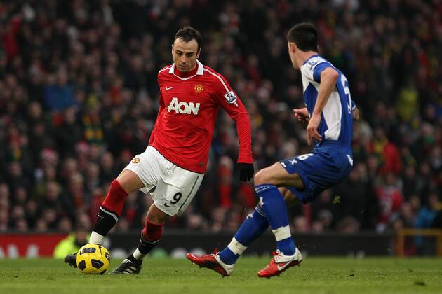 Football - Premier League - Manchester United vs. Birmingham City Dimitar Berbatov of Manchester United (L) faces Liam Ridgewell of Birmingham City at Old Trafford