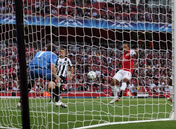 Arsneals Theo Walcott scoring his sides opening goal UEFA Champions League Qualifying Arsenal FC London v Udinese Calcio 16th August, 2011 EDITORIAL USE ONLY. No use with unauthorised audio, video, data, fixture lists, club league logos or live services. Online in-match use limited to 120 images, no video emulation. No use in betting, games or single club league player publications.