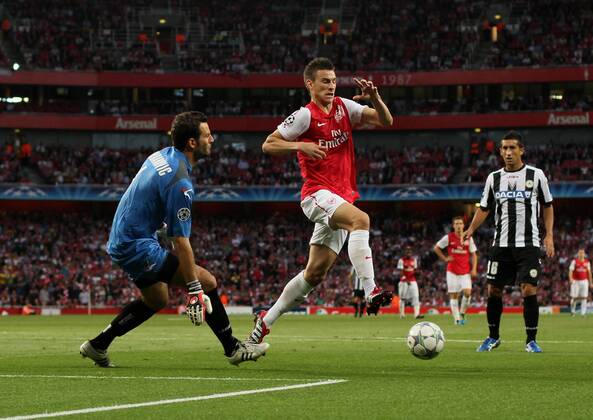 Arsneals Laurent Koscielny in action UEFA Champions League Qualifying Arsenal FC London v Udinese Calcio 16th August, 2011 EDITORIAL USE ONLY. No use with unauthorised audio, video, data, fixture lists, club league logos or live services. Online in-match use limited to 120 images, no video emulation. No use in betting, games or single club league player publications.