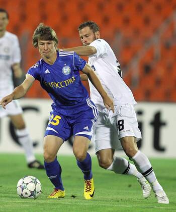 FUSSBALL - UEFA CL Play Off, Borisov vs Sturm MINSK,WEISSRUSSLAND,16.AUG.11 - FUSSBALL - UEFA Champions League, Play Off, FC BATE Borisow vs SK Sturm Graz. Bild zeigt Dmitri Baga (Borisov) und Jürgen Säumel (Sturm). 