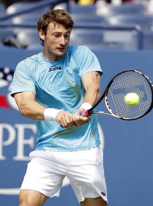Juan Carlos Ferrero of Spain hits a backhand on day 8 in Louis Armstrong Stadium at the U.S. Open Tennis Championships at the Billie Jean King National Tennis Center in New York City on September 5, 2011.  NYP20110905108