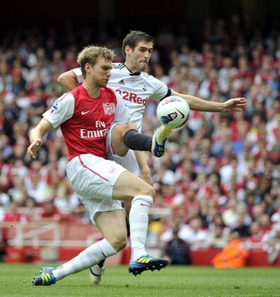 Premier League Arsenal v Swansea Per Mertesacker and Danny Graham in action 