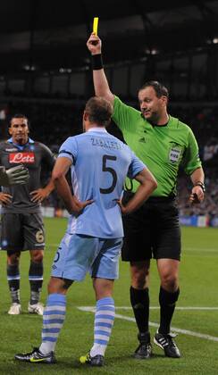 Pablo Zabaleta of Manchester City receives a yellow card UEFA Champions League Group A Manchester City v Napoli 14th September, 2011 EDITORIAL USE ONLY. No use with unauthorised audio, video, data, fixture lists, club league logos or live services. Online in-match use limited to 120 images, no video emulation. No use in betting, games or single club league player publications.