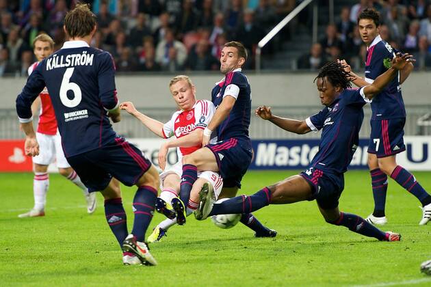 (L-R) Kolbeinn Sigthorsson of Ajax,Anthony Reveillere of Olympique Lyon,Bakary Kone of Olympique Lyon - Ajax Amsterdam vs. Olympique Lyonnais - UEFA Champions League 2011 2012 xVIxKarelxDelvoyex xOrangexPicturesxIVx 361415