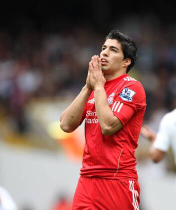 Liverpools Luis Suarez looks on dejected Barclays Premier League - Tottenham Hotspur v Liverpool FC - EDITORIAL USE ONLY. No use with unauthorised audio, video, data, fixture lists, club league logos or live services. Online in-match use limited to 120 images, no video emulation. No use in betting, games or single club league player publications.