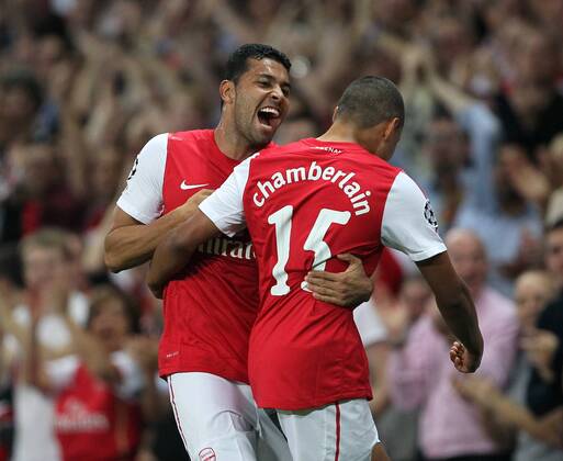 Arsenals Alex Oxlade-Chamberlain celebrates scoring his sides opening goal with Andre Santos UEFA Champions League Group F, Arsenal FC London --- Olympiakos Piräus EDITORIAL USE ONLY. No use with unauthorised audio, video, data, fixture lists, club league logos or live services. Online in-match use limited to 120 images, no video emulation. No use in betting, games or single club league player publications.