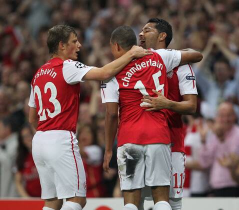 Arsenals Alex Oxlade-Chamberlain celebrates scoring his sides opening goal with Andre Santos UEFA Champions League Group F, Arsenal FC London --- Olympiakos Piräus EDITORIAL USE ONLY. No use with unauthorised audio, video, data, fixture lists, club league logos or live services. Online in-match use limited to 120 images, no video emulation. No use in betting, games or single club league player publications.